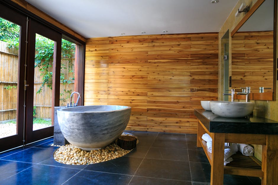 modern bathroom with natural stone and wooden bathtub large window
