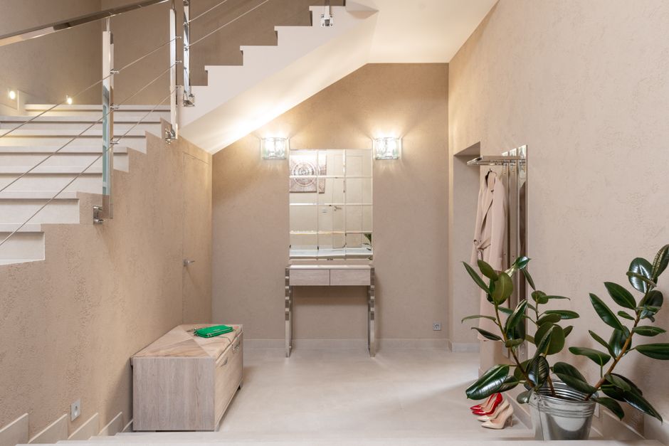 minimalist entrance hall with wooden storage and natural light