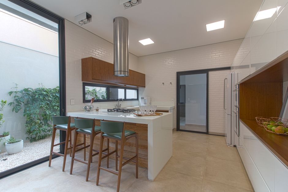 minimalist modern kitchen with wooden cabinets and natural light