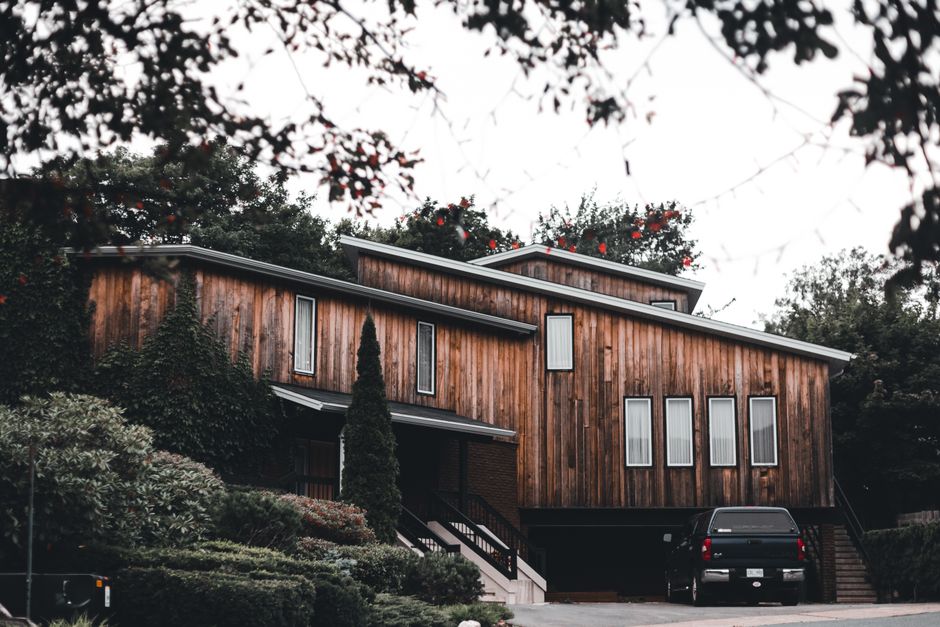 modern wood house exterior with warm lighting