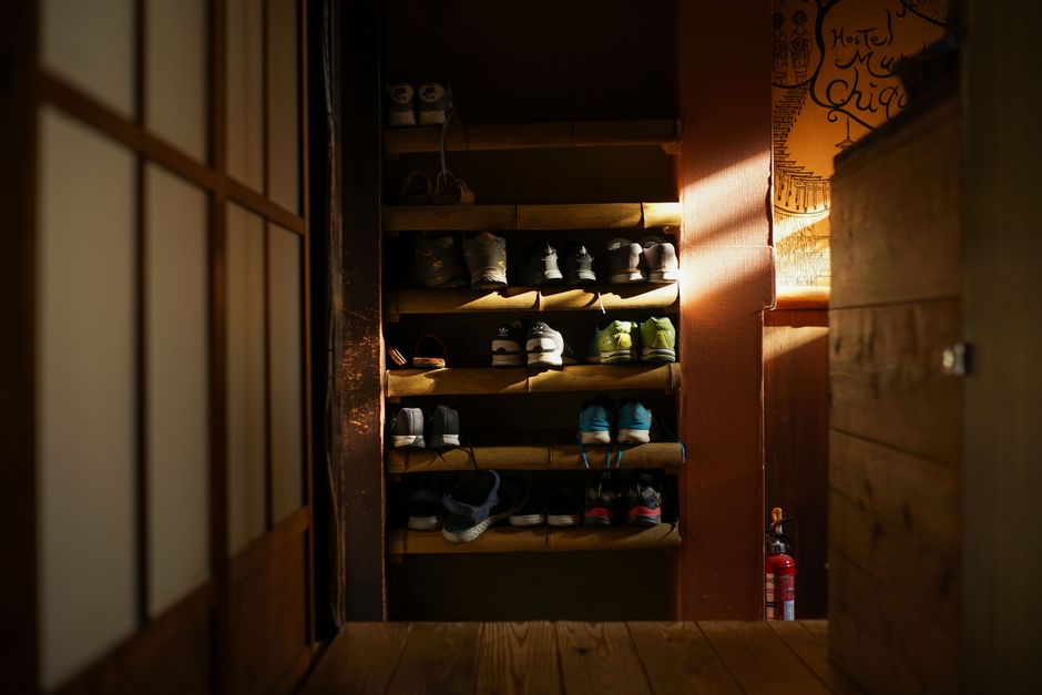 interior design of organized shoe storage with wooden shelves