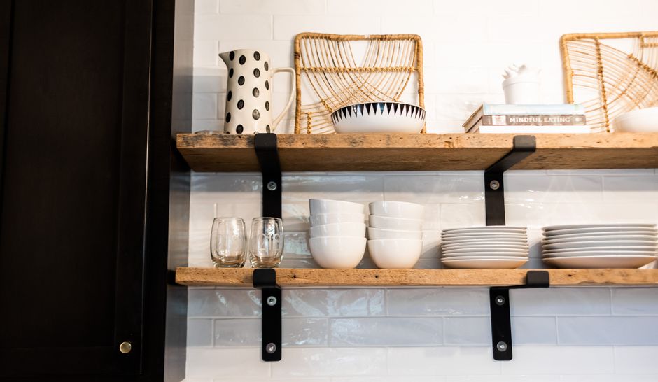 modern kitchen open shelving with ceramic dishes and plants