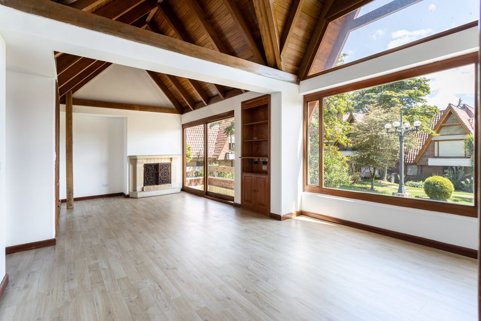 modern wood house interior with large glass windows