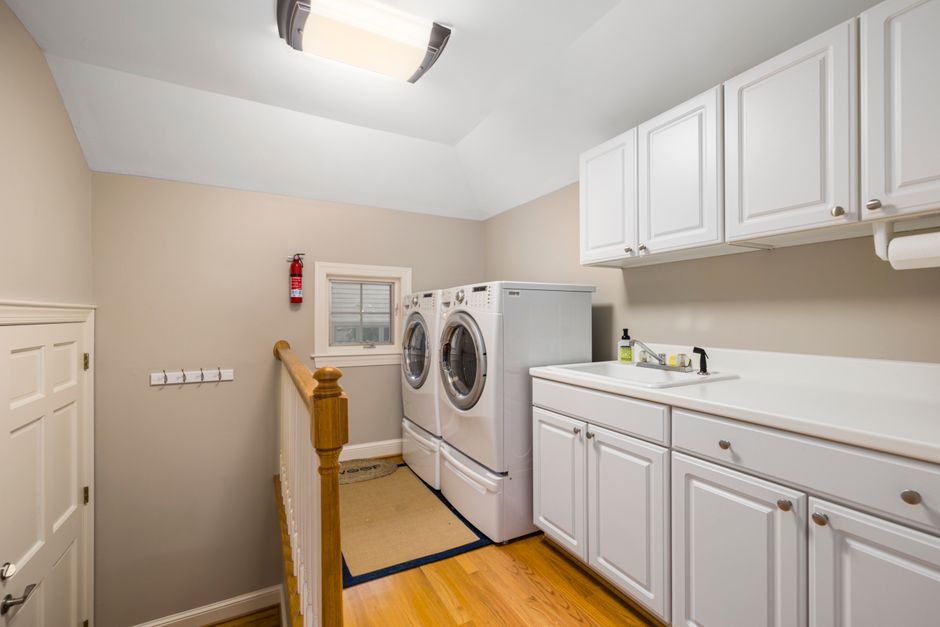 bright laundry room with wooden interior and sunlight