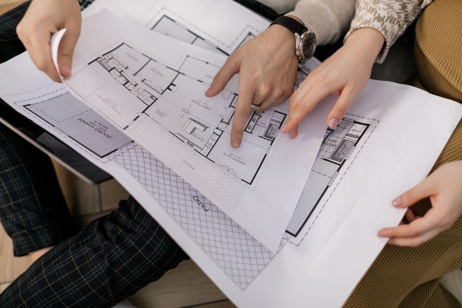 family discussing house plans with architect