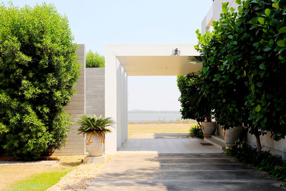modern house exterior with gravel driveway and minimalist plants