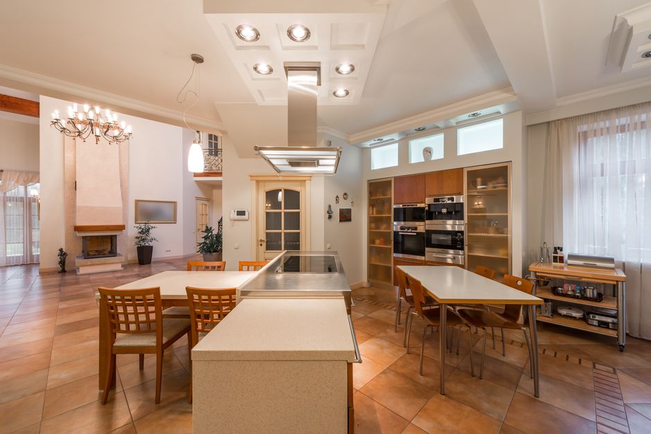 modern open plan kitchen with wooden dining table