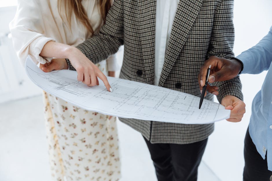 family discussing new home blueprint